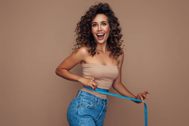 Young woman losing weight