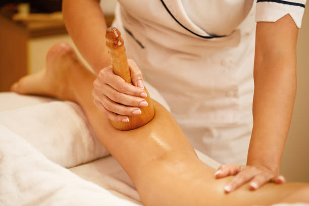 Close-up of woman having maderotherapy at beauty spa.